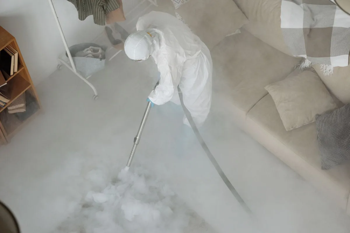 Biohazard cleanup technician in protective equipment, North Collins, NY